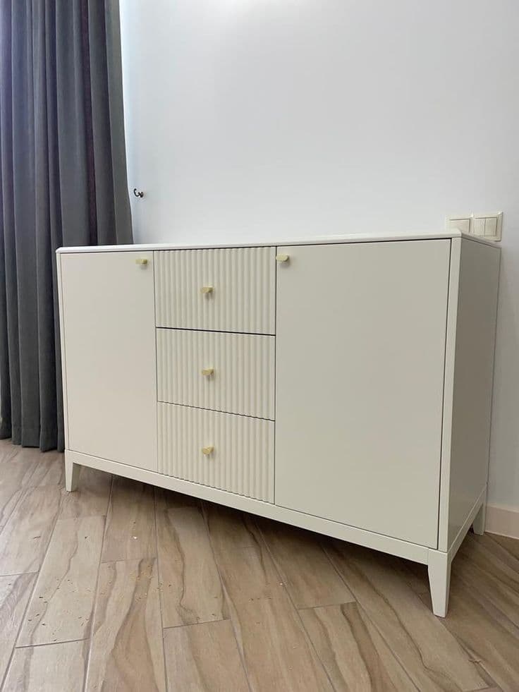 Minimal white console with tapered legs